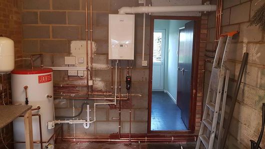 A new boiler and hot water tank that has been installed by our team
