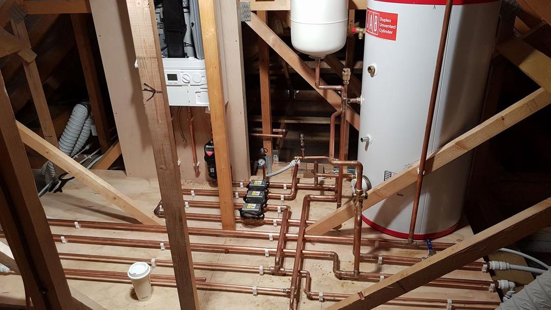 A boiler and new piping installed by our team