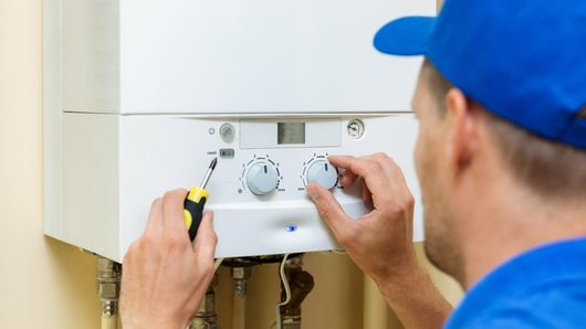 One of Our team repairing a Boiler